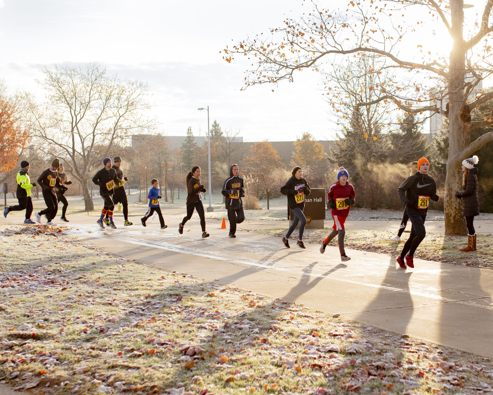 Runners make their way past the 3k mark